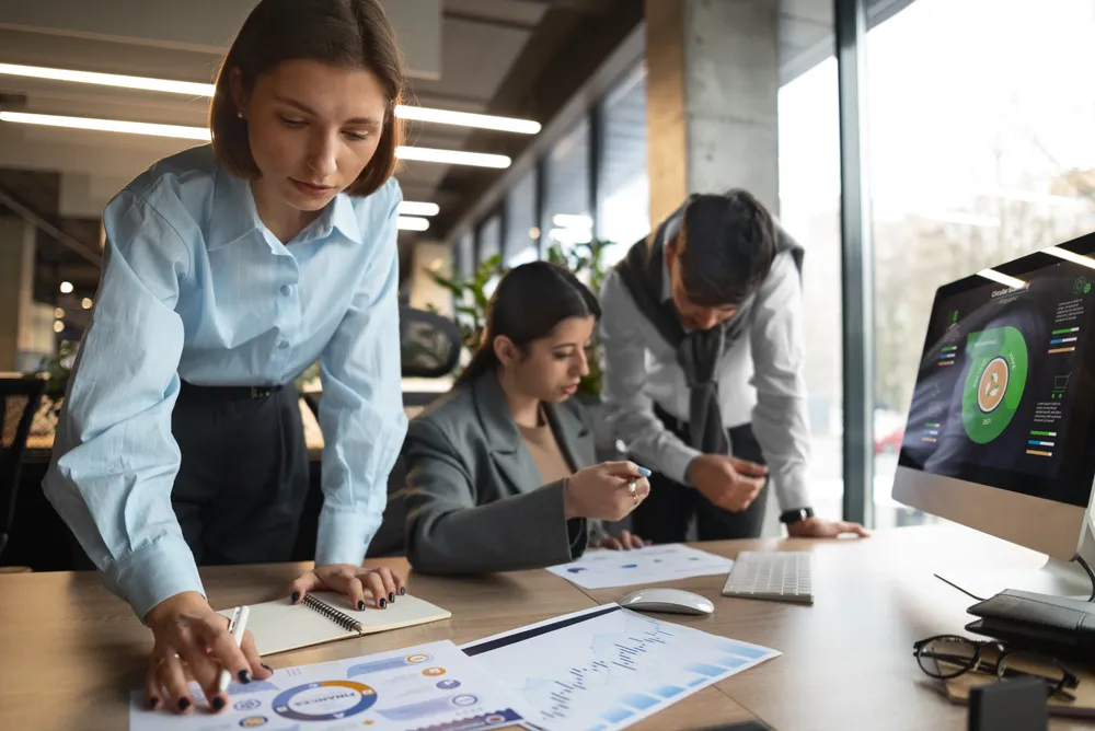 people-analyzing-checking-finance-graphs-office