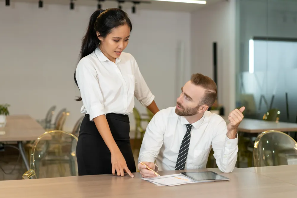 confident-business-people-discussing-sales