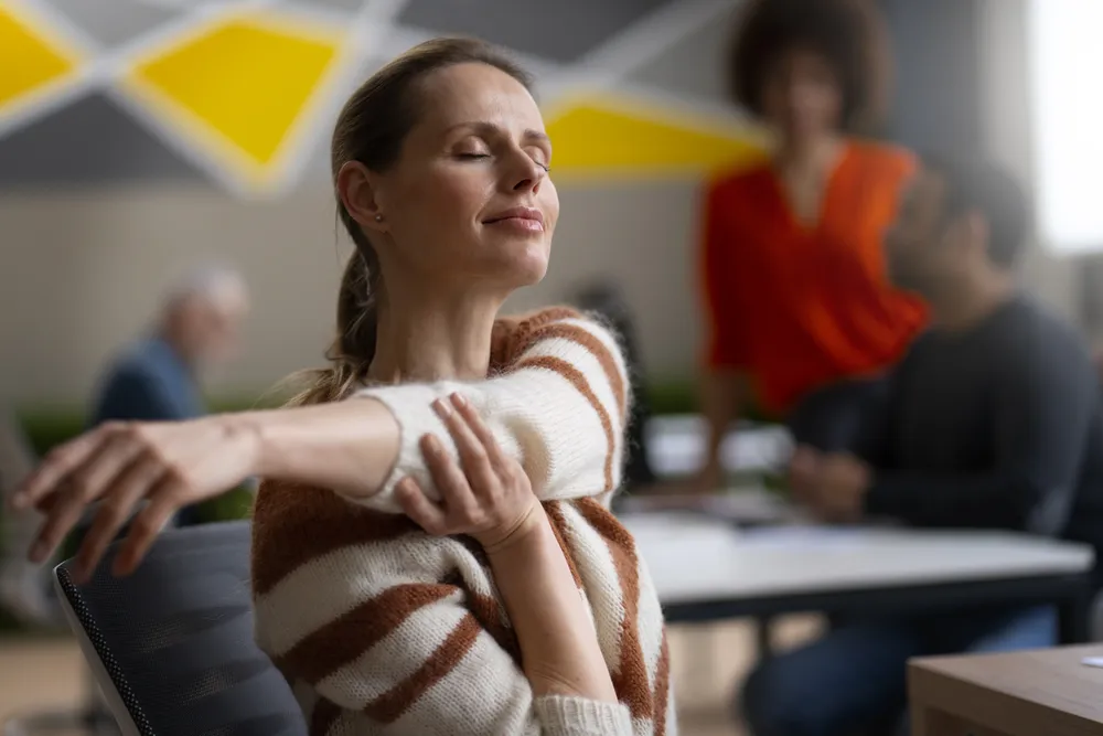 woman-office-stretching-work-day